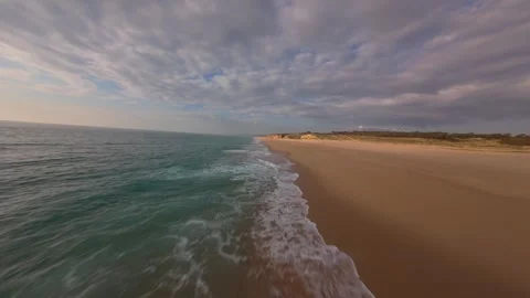 Drone captures serene coastline with turquoise waters and soft sand Stock Footage 340225653