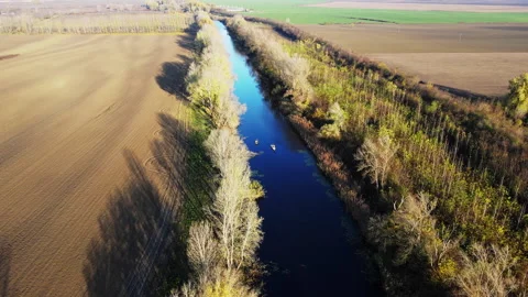 Drone captures small boats on a river with men fishing Stock-Footage 263188033
