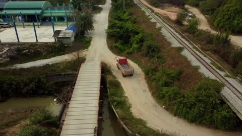 Drone Captures Small Earth Mover Truck Passing Rural Mosque in Thailand Stock Footage 305018481