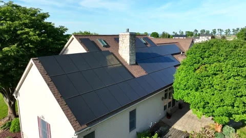Drone captures solar panel installation on American home rooftop.  Aerial Stock Footage 246353246