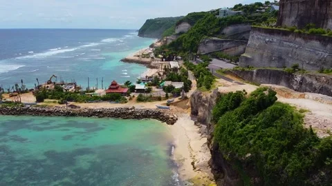 Drone captures the stunning white sands and limestone cliffs of Melasti Beach, U Stock Footage 309277040