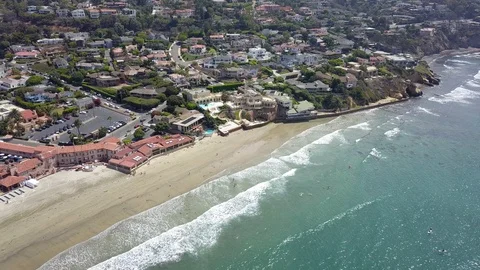 Drone captures sunbathers on a La Jolla beach on a sunny San Diego summer day Stock Footage 97972137