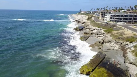 Drone captures sunbathers on a La Jolla beach on a sunny San Diego summer day Stock Footage 97972613
