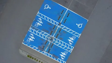 A drone captures a top view of road parking near a store Stock Footage 274635494