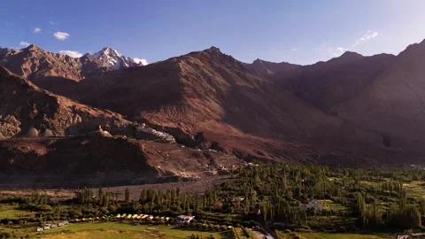 Drone capturing the ancient spirit of Diskit Monastery nestled in Himalayan Stock Footage 310900590