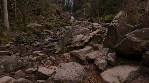 Drone capturing cascading water of Grande Cascade de Tendon France Stock Footage 306795586