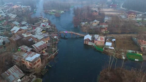 Drone capturing the dreamy layers of frost and mist blanketing Dal Lake’s Stock Footage 311020677