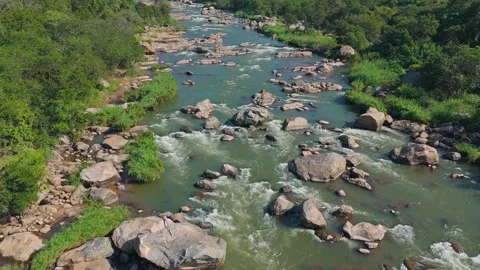Drone capturing rippling water of Crocodile River winding through African valley Stock Footage 340263400