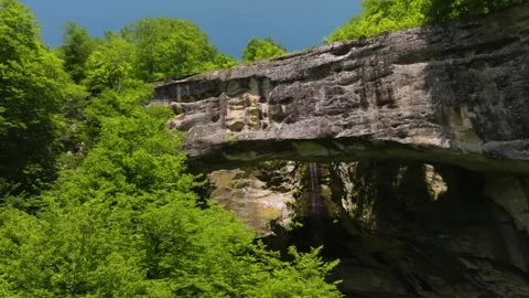 Drone capturing Stone Bridge, Dagestan, Russia, with vast expanses of greenery, Stock Footage 303393990