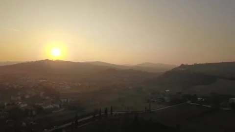 Drone Capturing Stunning Warm Hazy Sunset Over Italian Hills Stock Footage 304843830