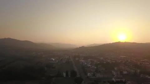 Drone Capturing Stunning Warm Hazy Sunset Over Italian Hills Stock Footage 304843836
