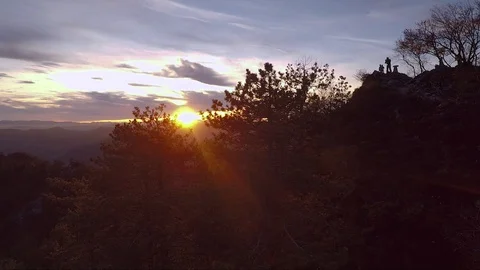 Drone Capturing Sunset and Hikers on a Hill Stock Footage 87148986