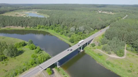 Drone Car Driving On Empty Road Along Sunny Summer Forest Video stock 243628034