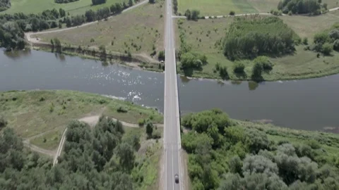 Drone Car Driving On Empty Road Along Sunny Summer Forest Video stock 243628241