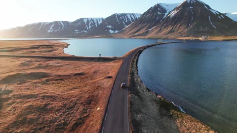 Drone Of Car Driving On Road Over Fjords Towards Mountains Stockbeeldmateriaal 166245230