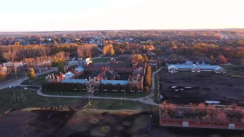 Drone, castle, top view, gothic building, autumn, sunset, golden trees, field Video stock 163679233