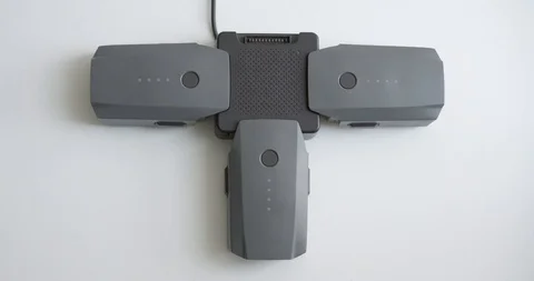 Drone charging items close-up. Mavic batteries and hub. Stock Footage 103274448