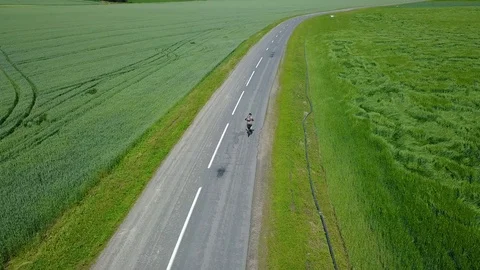 Drone chase the cyclist Stock Footage 100970510