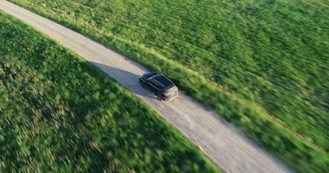 Drone chasing a black car Stock Footage 94989349