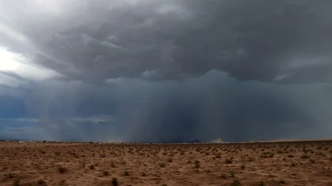 Drone chasing a dramatic lightening storm in the Mojave Desert basin with Stock Footage 160801023