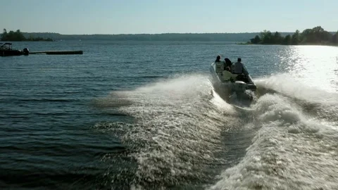 Drone chasing a pleasure craft as if takes off Stock Footage 134300115