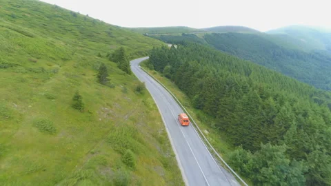 Drone chasing а roadside assistance on mountain pass Stock Footage 135670060