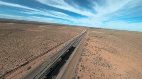 Drone chasing shot of a cargo train in the remote desert of Arizona Stock Footage 165027571