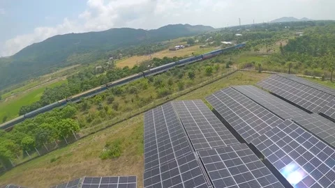 Drone chasing a train flying over solar panels Stock-Footage 236634802