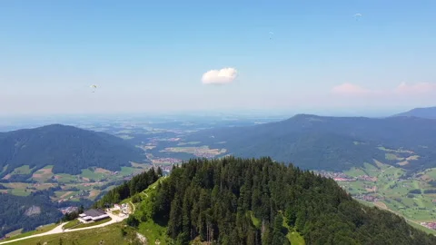 Drone Circle Around Hill with Trees and Paragliders Stock Footage 280793509