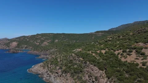 Drone circle pan arround rocky, sardinian coast with cristal clear water Stock Footage 280275484