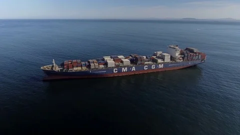 Drone circles high and slow around huge container ship Vídeo Stock 83534452