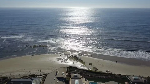 Drone circles over clifftop oceanfront mansions in San Diego California Stock Footage 87954275