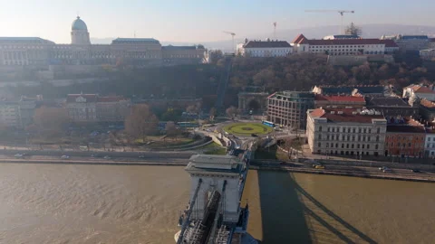 Drone circles over the Danube river shooting incredible landscapes of Budapest Stock Footage 265543380