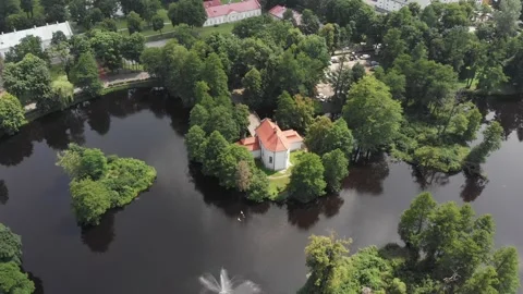 Drone circling above the Church on water pond in Zwierzyniec, Poland Stock Footage