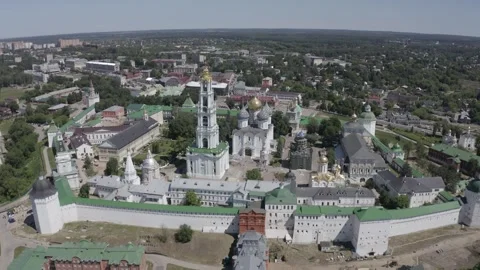 Drone circling above monastery complex with cathedral domes Видео 332309572