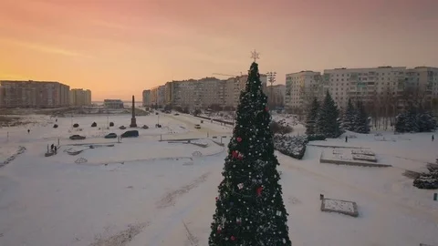 Drone circling around the Christmas tree in the central square at sunset.Ukraine Stock Footage 71456002