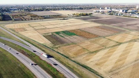 Drone Circling Around Sasktatoon Fields, Highways, and Houses Stock-Footage 140079192