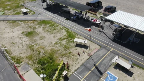 DRONE CIRCLING AROUND WIND SOCK Stock Footage 239947574