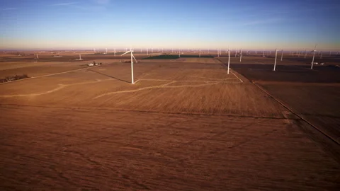 Drone circling construction crews working on turbine structures Stock Footage 329221969
