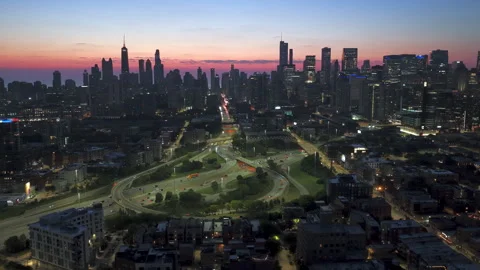 Drone circling the interchange on Kennedy Expressway, dusk in West Town, Chicago Stock Footage 327367947