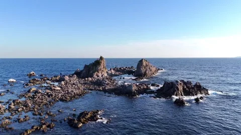 Drone Circling View of Sacred Three Stones in Ocean Kanagawa Japan 4K Stock Footage 329058008