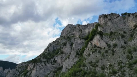 Drone Climb Along Eagle Eye Cliff Revealing Dramatic Limestone Walls, Bulgar Stock Footage 340832854