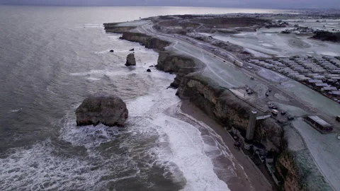 Drone climbs over rugged, winter coastline in England Stock Footage 236364267