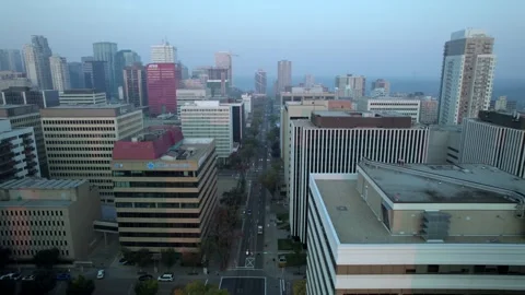 Drone clip of Edmonton Rooftops along a street on a hazy afternoon Stock Footage 250500481