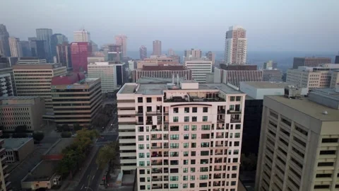 Drone clip of Edmonton Rooftops with Helipad on a hazy afternoon Stock Footage 250500557