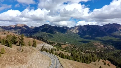 Drone clip over highway in the sawtooth mountains in early fall Stock Footage 320575646