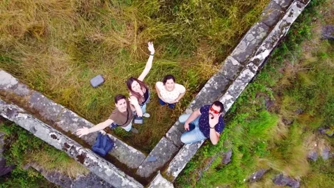 Drone clip taking off above a group of friends on the countryside Stock Footage 134498027