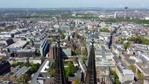 Drone close-up of Cologne Cathedral twin spires with city Skyline in background Stock-Footage 333723400