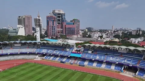 Drone close-up of the empty M. Chinnaswamy Stadium in front of UB City buil.. Stock-Footage 330274610