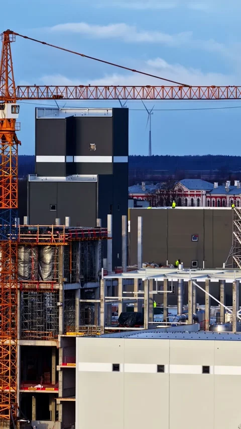 Drone Close-Up of Industrial Construction Site with Wind Turbines in Northern Stock Footage 337150534